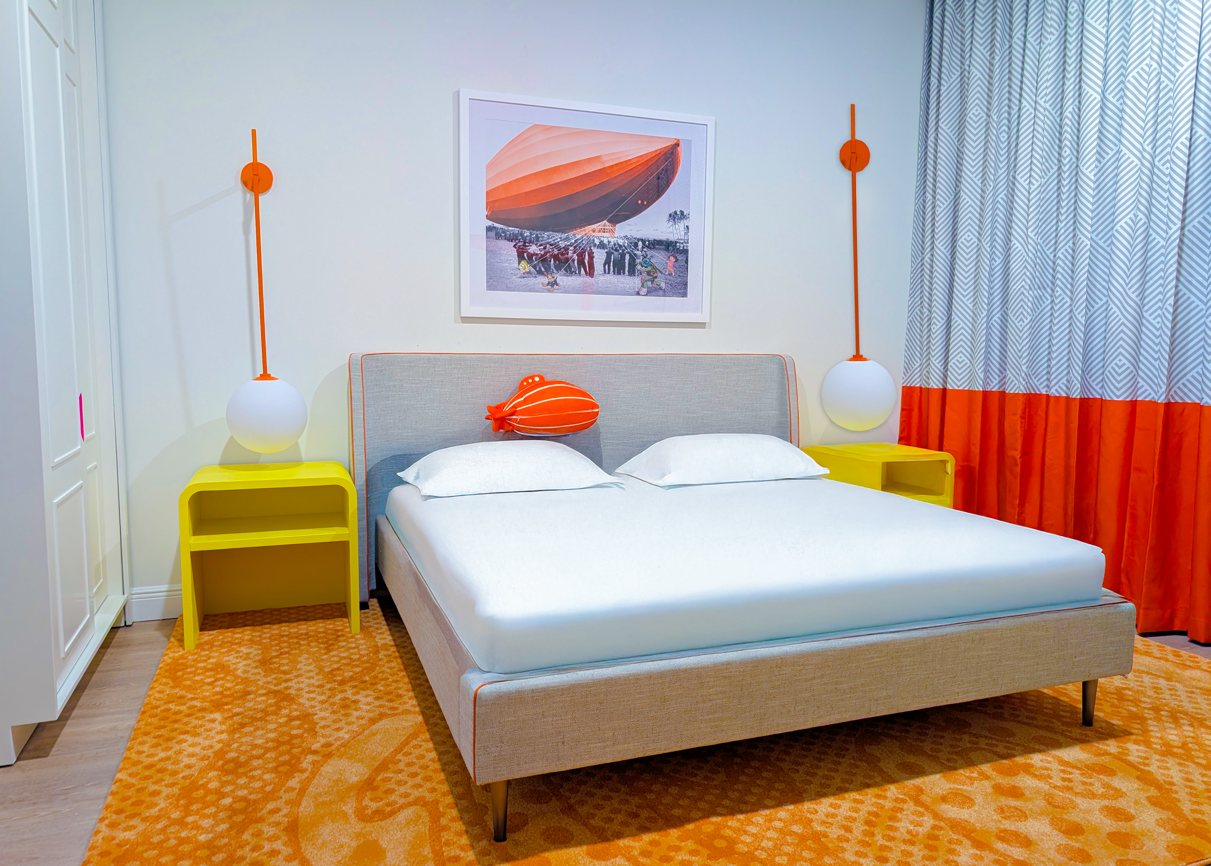 Bedroom with orange accent wall